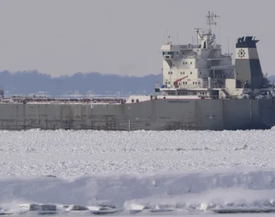 Freighter trapped in ice on frozen Lake Erie, stranding the vessel